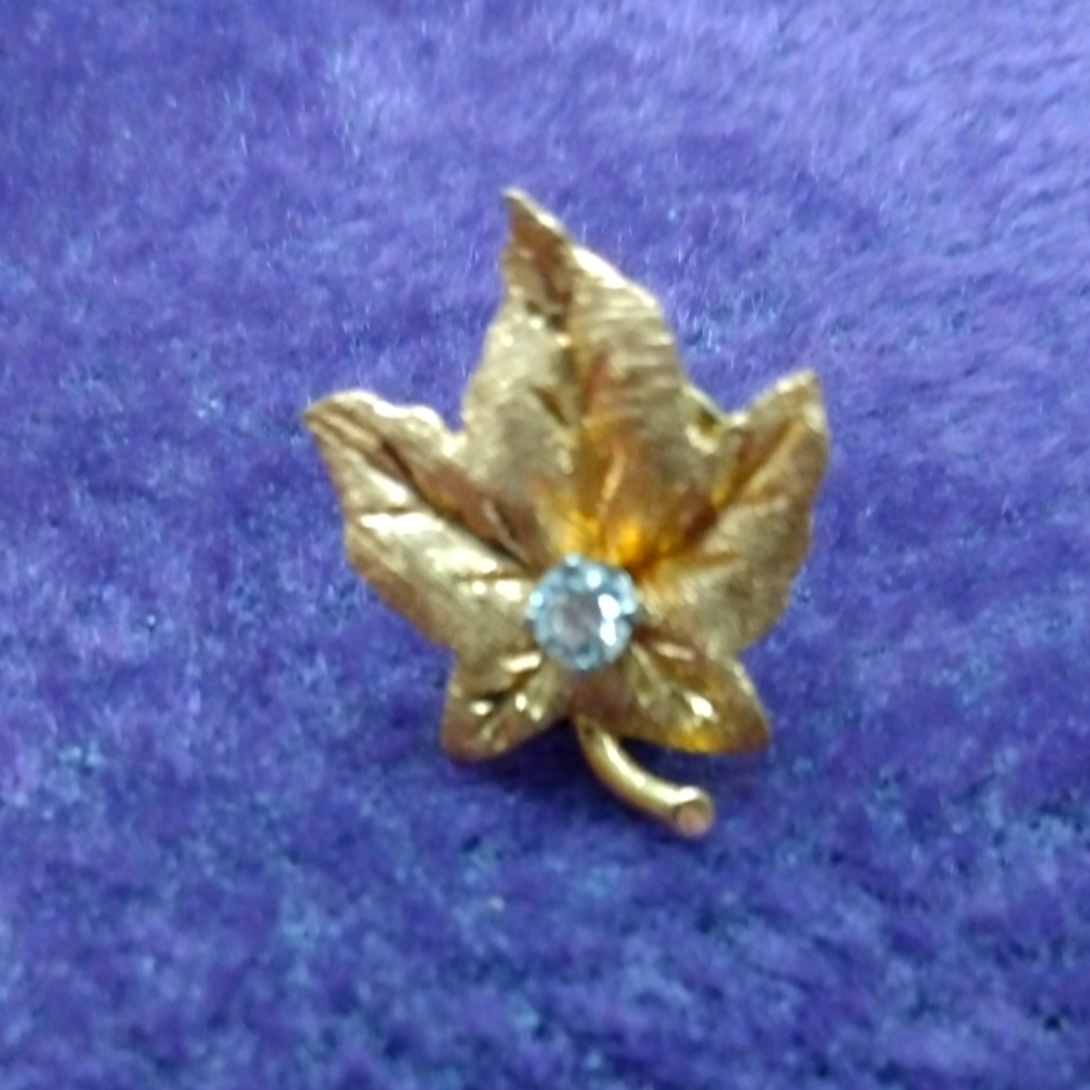 Gold plated Maple leaf with diamond in center